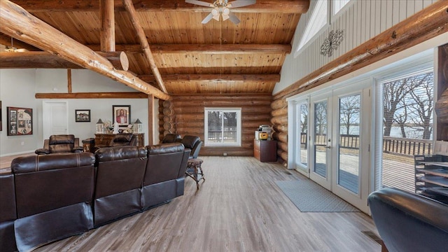 living room featuring beam ceiling, french doors, wooden ceiling, wood finished floors, and high vaulted ceiling