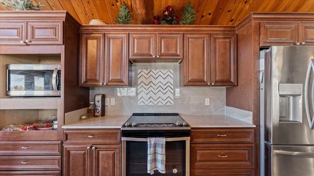 kitchen with decorative backsplash, stainless steel appliances, and light countertops