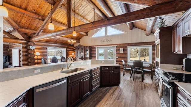 kitchen featuring a sink, dark wood finished floors, french doors, appliances with stainless steel finishes, and dark brown cabinets