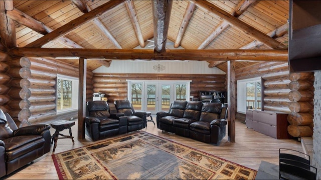 unfurnished living room with french doors, beam ceiling, and wood finished floors