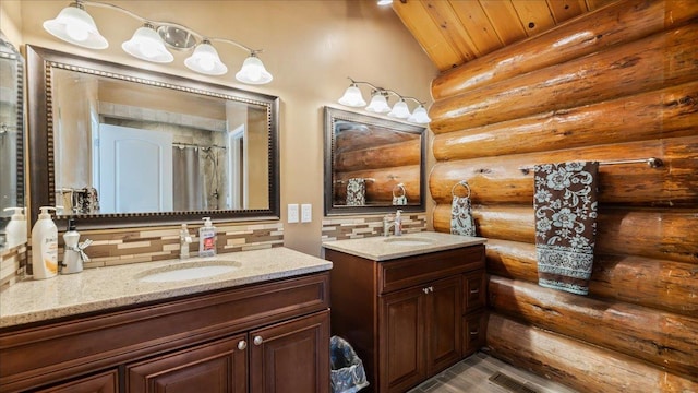 bathroom with a sink, rustic walls, backsplash, and two vanities