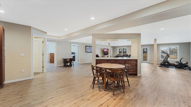 dining space with recessed lighting, light wood-type flooring, and baseboards