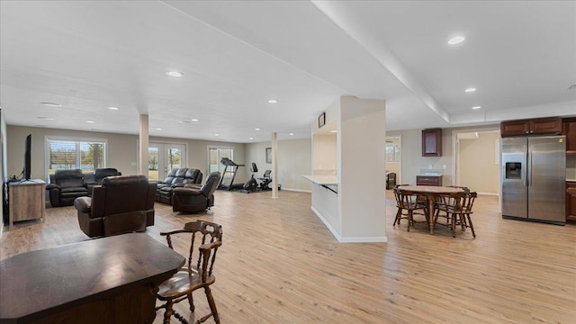 dining room featuring a wealth of natural light, baseboards, light wood-style floors, and recessed lighting