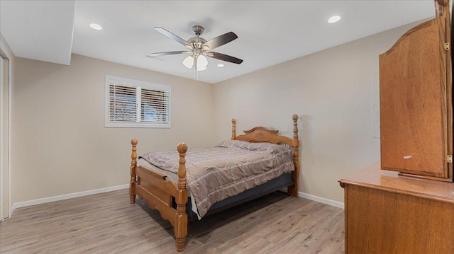 bedroom featuring a ceiling fan, recessed lighting, light wood-style floors, and baseboards