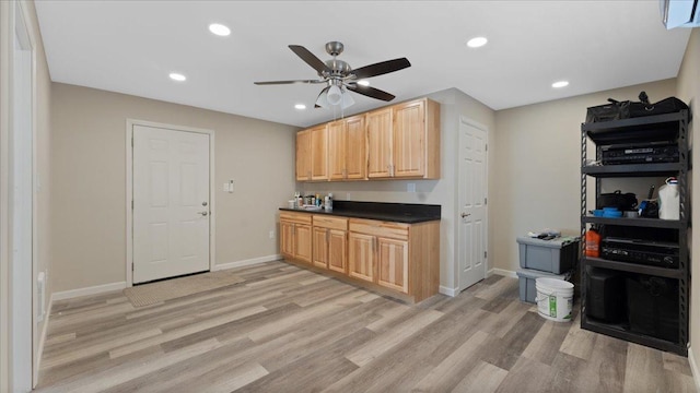 kitchen with dark countertops, light wood-style flooring, recessed lighting, and light brown cabinetry