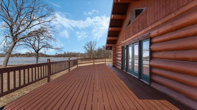 wooden terrace with french doors and a water view