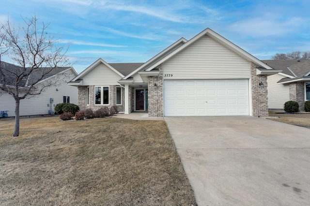 single story home with a front yard, an attached garage, brick siding, and concrete driveway