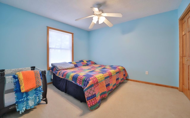 8403 Red Pine Cir, Baxter, MN 56425 - carpeted bedroom with baseboards, ceiling fan, and a closet
