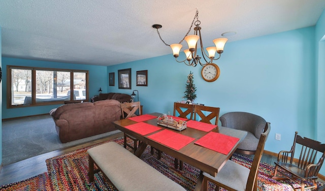 8403 Red Pine Cir, Baxter, MN 56425 - dining space with a chandelier, a textured ceiling, wood finished floors, and baseboards