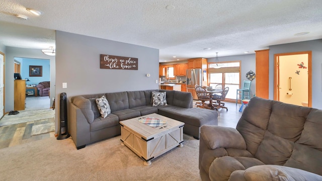8403 Red Pine Cir, Baxter, MN 56425 - living area featuring a textured ceiling, recessed lighting, and light colored carpet