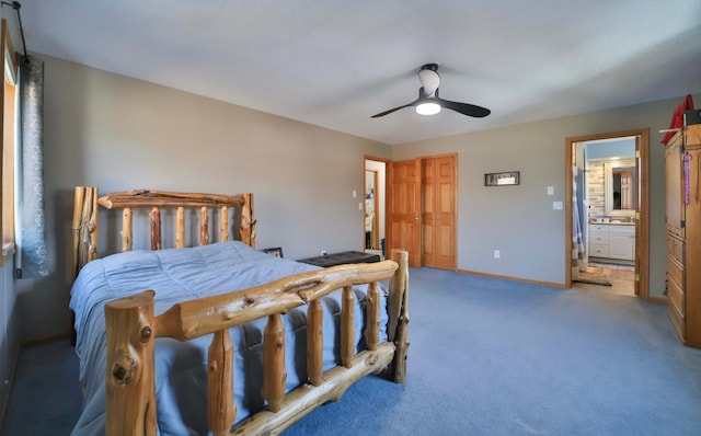 8403 Red Pine Cir, Baxter, MN 56425 - bedroom with light colored carpet, ceiling fan, ensuite bath, and baseboards