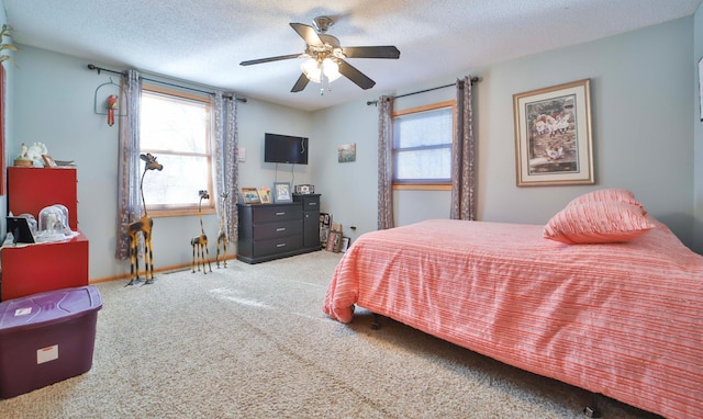 8403 Red Pine Cir, Baxter, MN 56425 - carpeted bedroom with baseboards, a ceiling fan, and a textured ceiling