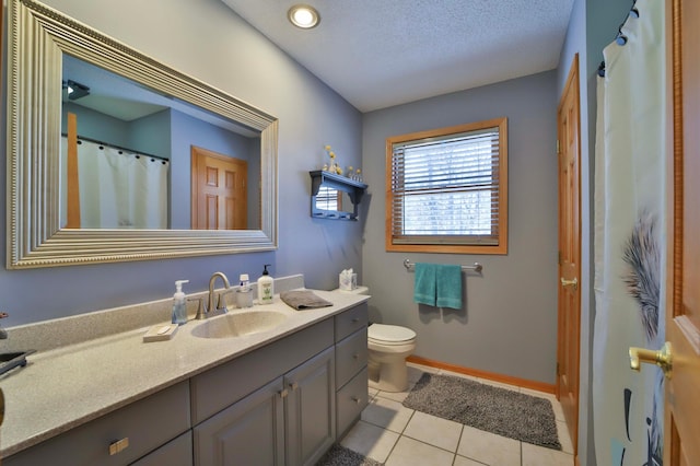 8403 Red Pine Cir, Baxter, MN 56425 - bathroom with vanity, toilet, tile patterned flooring, baseboards, and a textured ceiling