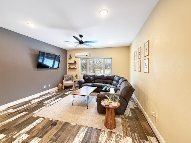 living area featuring a ceiling fan, a wall mounted AC, baseboards, and wood finished floors