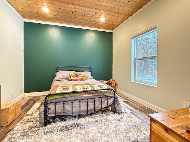 bedroom with baseboards, wood ceiling, and ornamental molding