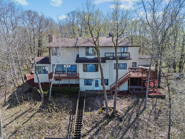 3694 Iona Way SW, Alexandria, MN 56308 - back of house with stairs, a wooden deck, and a balcony