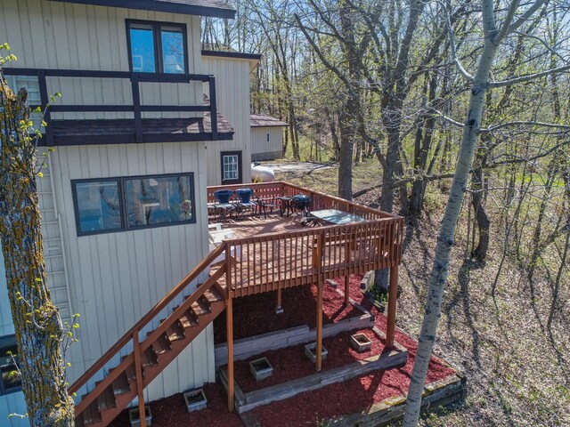 3694 Iona Way SW, Alexandria, MN 56308 - wooden deck featuring stairway and outdoor dining space