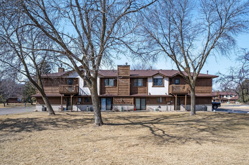 12617 Alder St NW, Coon Rapids, MN 55448 - view of front of property with a balcony and a chimney