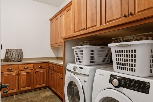 laundry room with cabinet space and separate washer and dryer