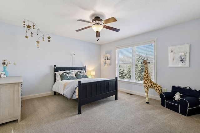 bedroom featuring visible vents, baseboards, and light colored carpet