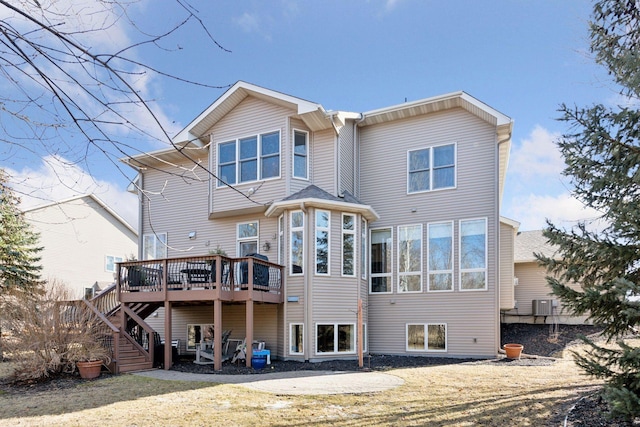 rear view of house featuring central air condition unit, a deck, and stairs