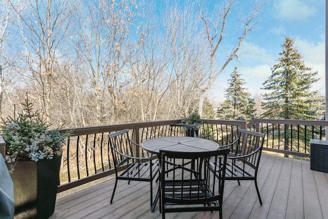 wooden deck with outdoor dining space