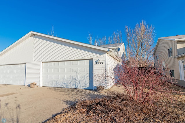 view of side of property featuring driveway