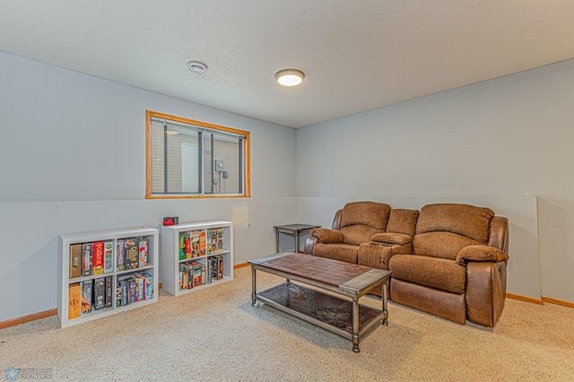 living area with baseboards, carpet, and a textured ceiling