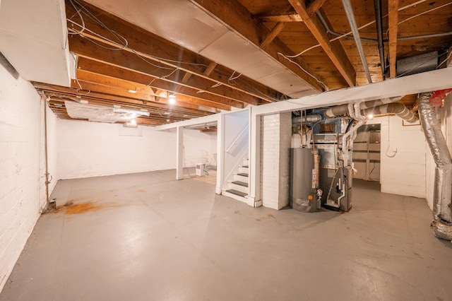 unfinished below grade area with gas water heater, heating unit, and stairs