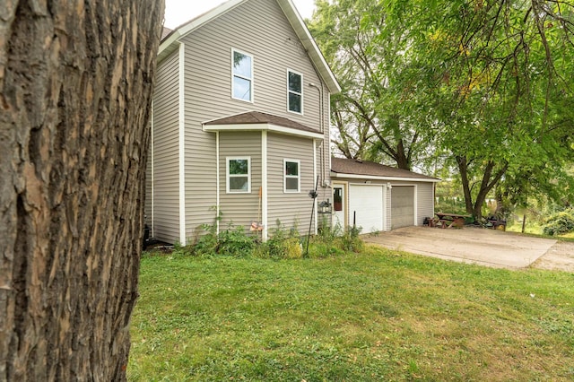 view of property exterior featuring a yard and a garage