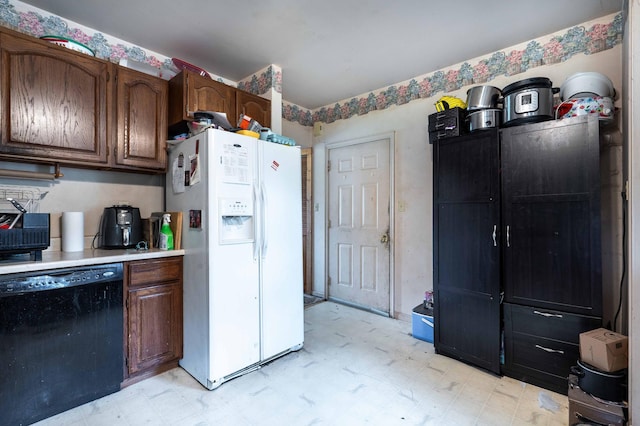 kitchen with light floors, dishwasher, white refrigerator with ice dispenser, and light countertops