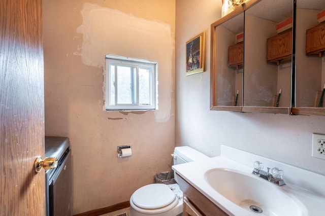 half bath with toilet and vanity