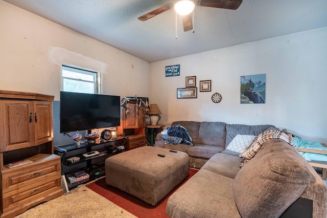 living area with carpet flooring and ceiling fan