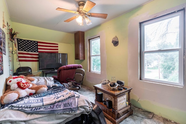 carpeted bedroom featuring a ceiling fan