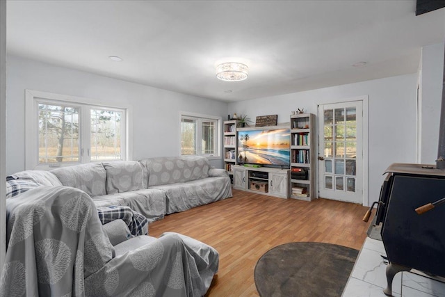 living area with a healthy amount of sunlight and wood finished floors