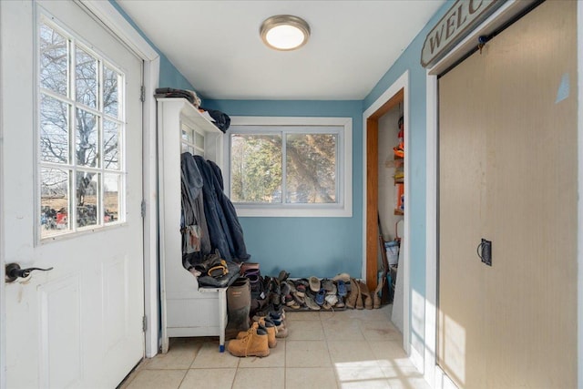 doorway with tile patterned floors