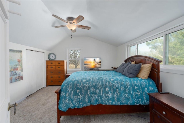 bedroom featuring ceiling fan, lofted ceiling, and light carpet