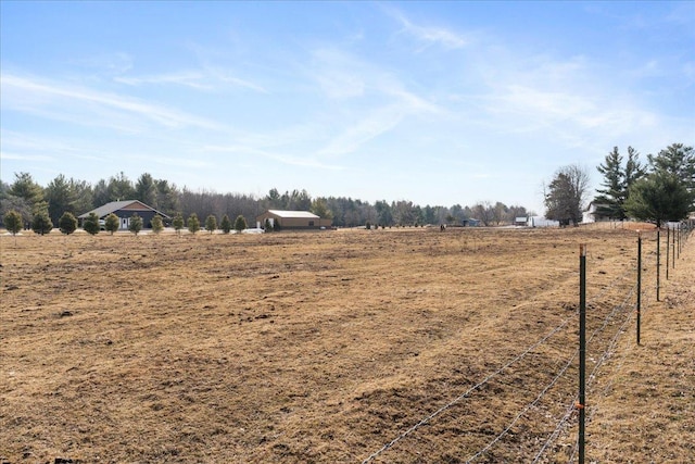 view of yard with a rural view