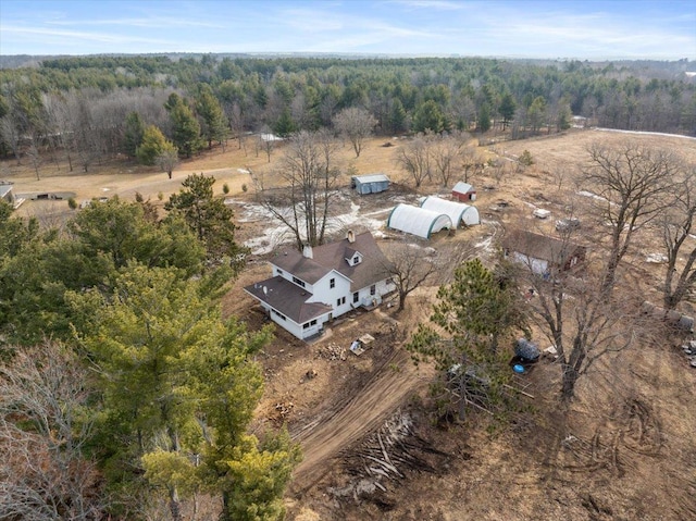 aerial view featuring a rural view and a wooded view