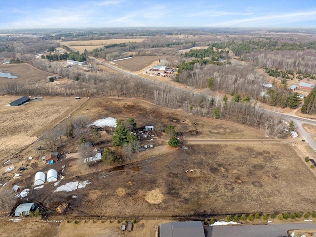 birds eye view of property with a rural view