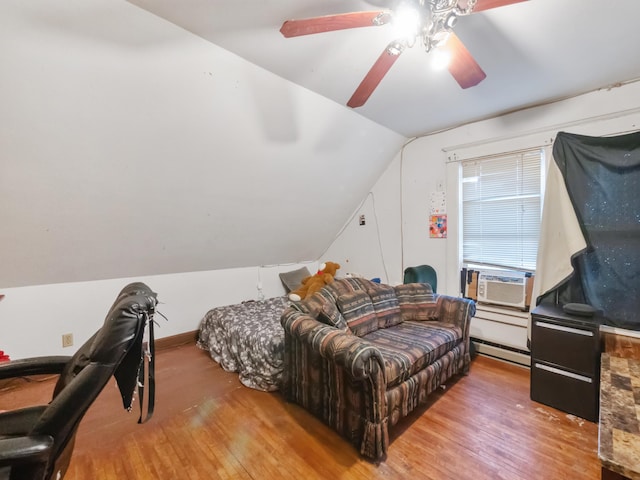 bedroom with a baseboard radiator, wood-type flooring, lofted ceiling, and a ceiling fan