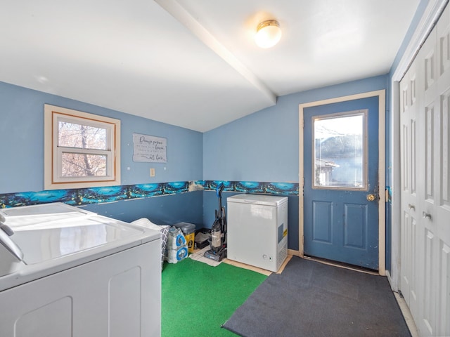 laundry area with washer and clothes dryer, laundry area, and a wealth of natural light