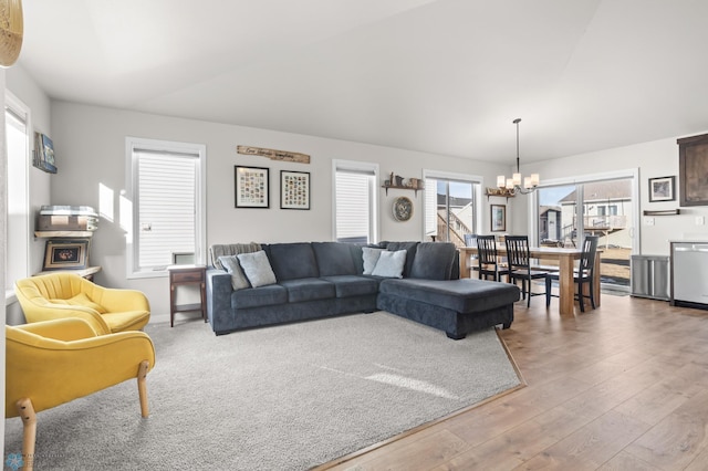 living area with wood finished floors and a chandelier