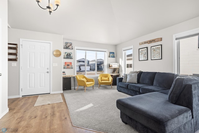 living area featuring baseboards and light wood-type flooring