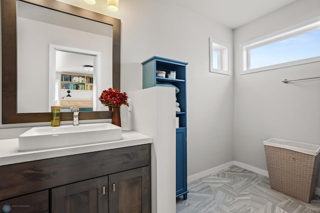 bathroom featuring vanity and baseboards