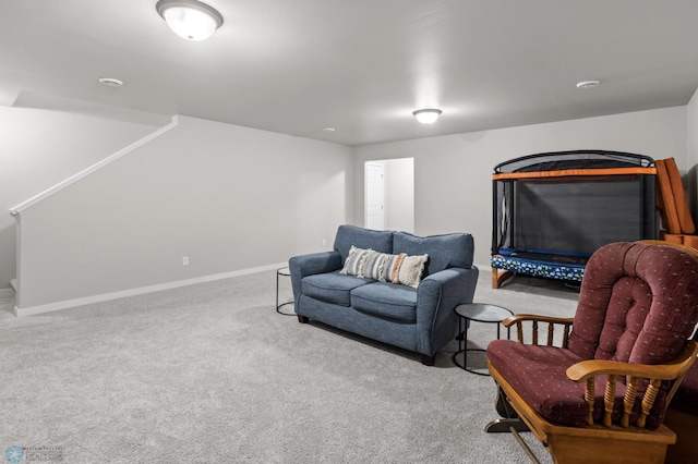 sitting room with carpet flooring and baseboards