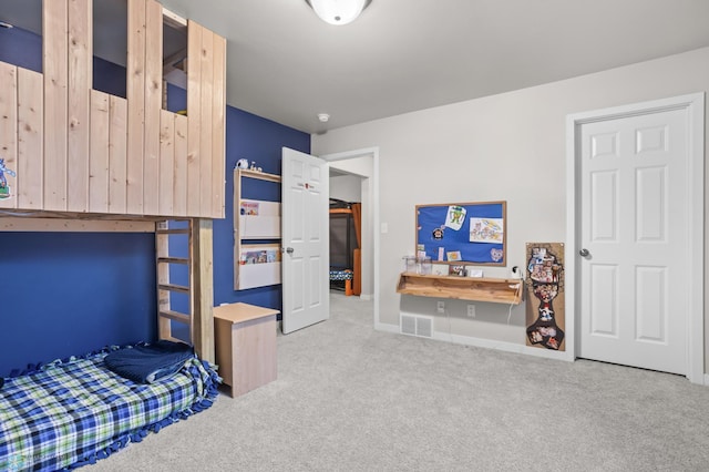 carpeted bedroom with visible vents