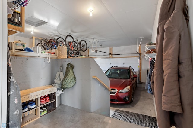 garage with bike storage and a garage door opener