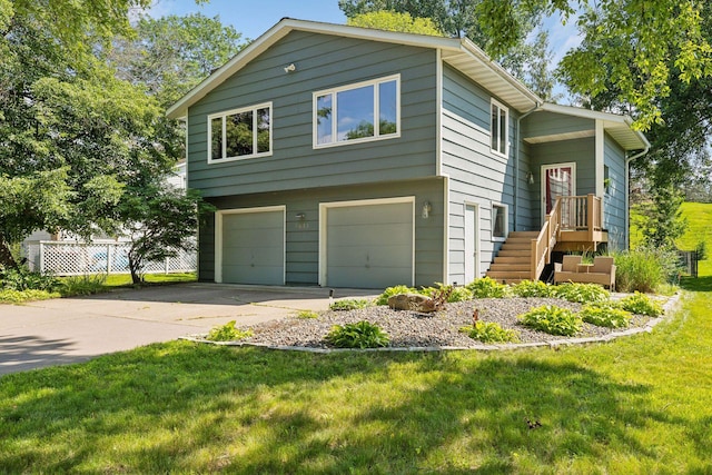 view of front of house featuring stairway, an attached garage, driveway, and a front lawn