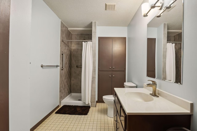 full bath with visible vents, a textured ceiling, tiled shower, and vanity